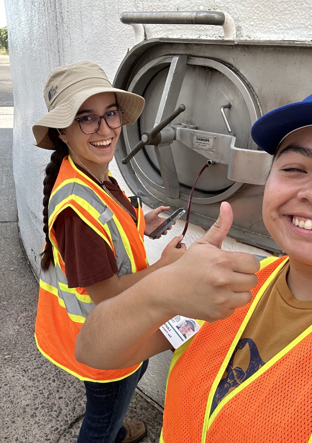 Interns Shelby Perry and Laura Ruiz giving a thumbs up at the Fresno facility